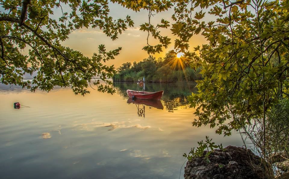 Hiking on the trails around Lake Trichonida in the summer